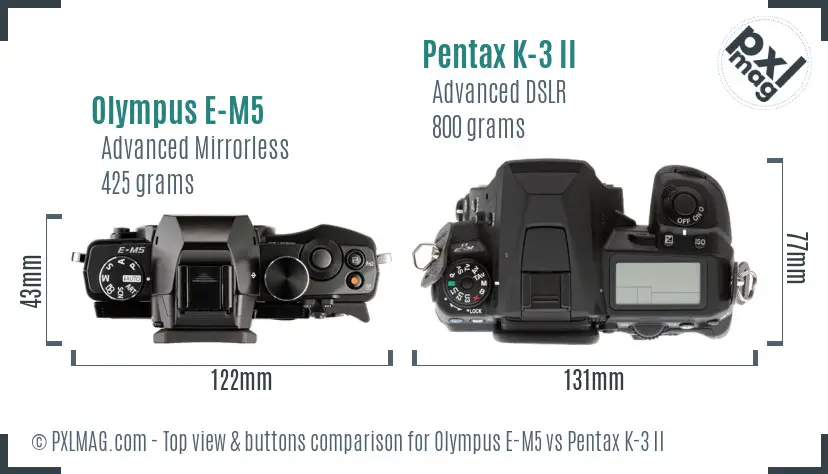 Olympus E-M5 vs Pentax K-3 II top view buttons comparison