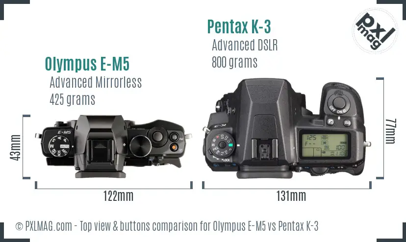 Olympus E-M5 vs Pentax K-3 top view buttons comparison