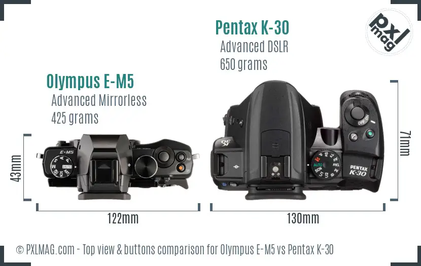 Olympus E-M5 vs Pentax K-30 top view buttons comparison