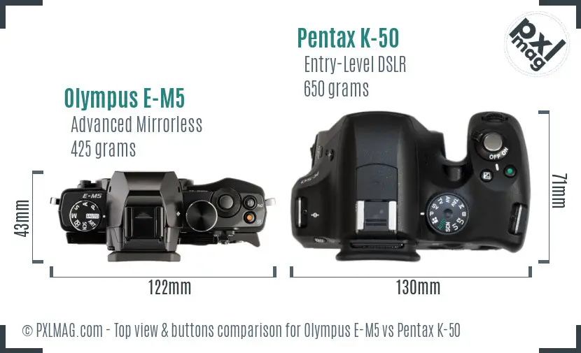 Olympus E-M5 vs Pentax K-50 top view buttons comparison
