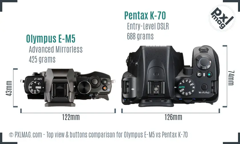 Olympus E-M5 vs Pentax K-70 top view buttons comparison