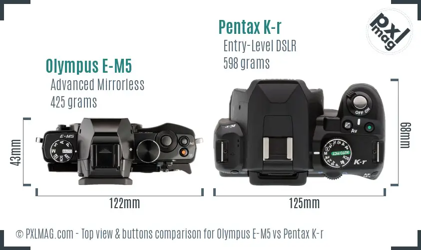 Olympus E-M5 vs Pentax K-r top view buttons comparison