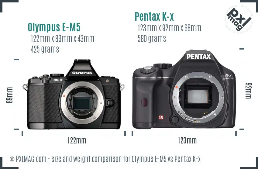 Olympus E-M5 vs Pentax K-x size comparison