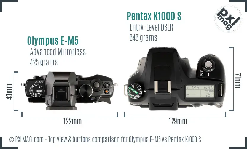 Olympus E-M5 vs Pentax K100D S top view buttons comparison