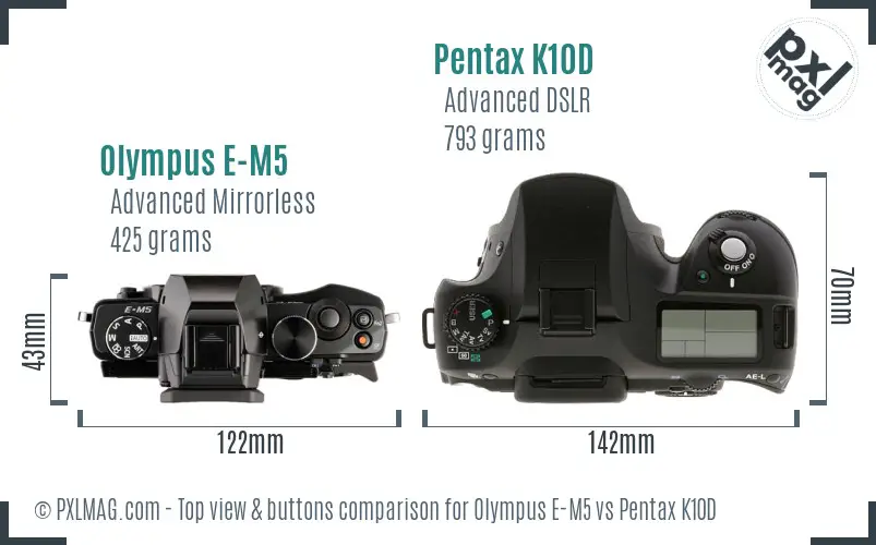 Olympus E-M5 vs Pentax K10D top view buttons comparison