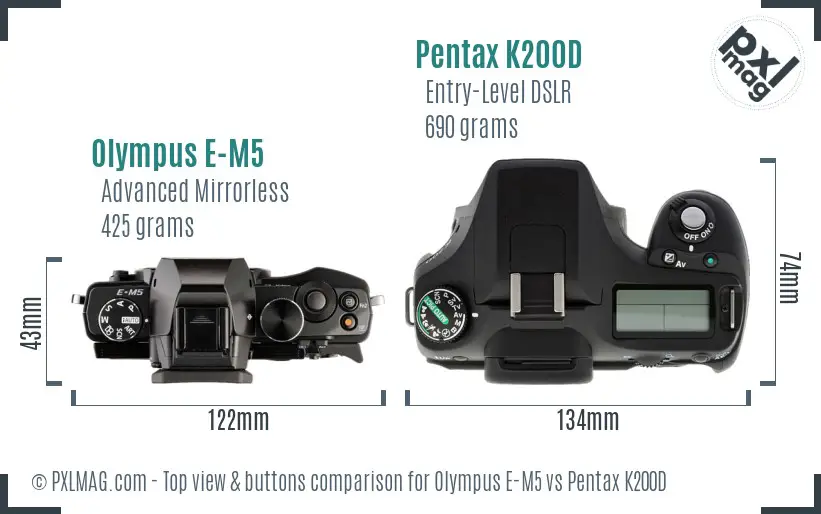 Olympus E-M5 vs Pentax K200D top view buttons comparison
