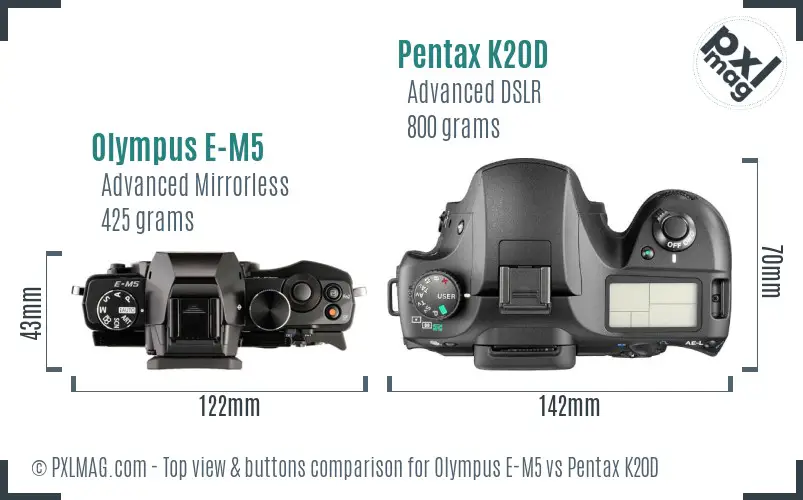 Olympus E-M5 vs Pentax K20D top view buttons comparison