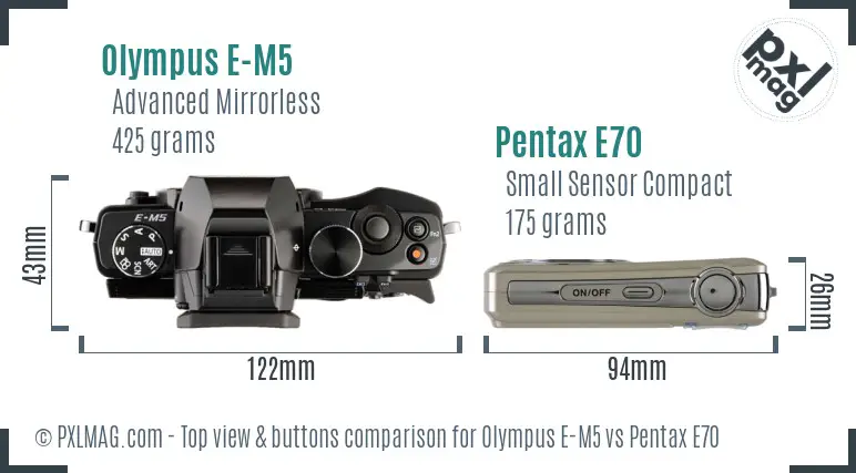 Olympus E-M5 vs Pentax E70 top view buttons comparison