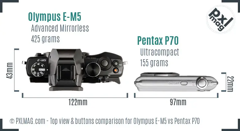Olympus E-M5 vs Pentax P70 top view buttons comparison