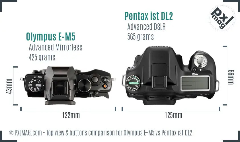 Olympus E-M5 vs Pentax ist DL2 top view buttons comparison