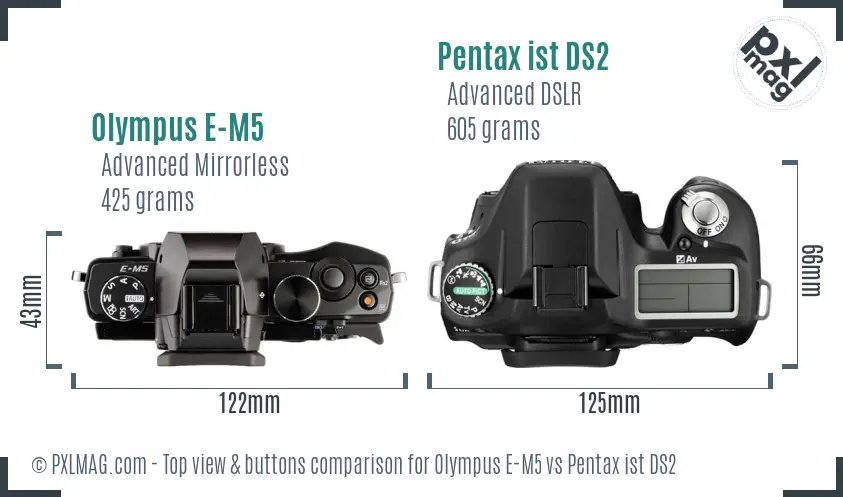 Olympus E-M5 vs Pentax ist DS2 top view buttons comparison