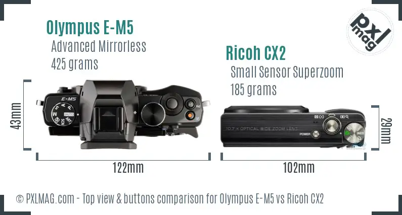 Olympus E-M5 vs Ricoh CX2 top view buttons comparison