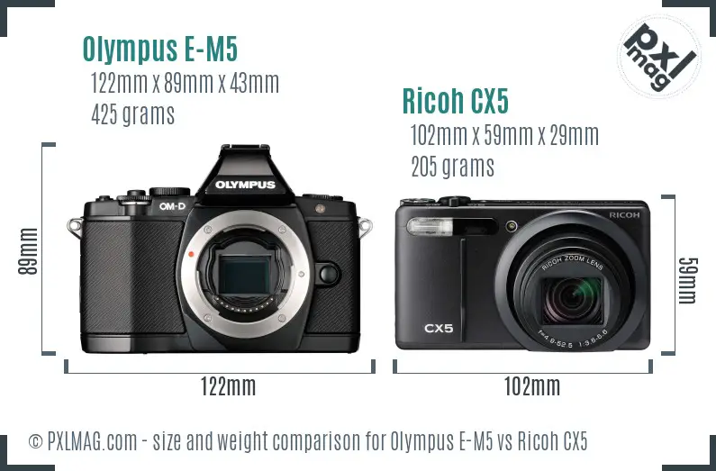 Olympus E-M5 vs Ricoh CX5 size comparison Olympus E-M5 vs Ricoh CX5 size comparison
