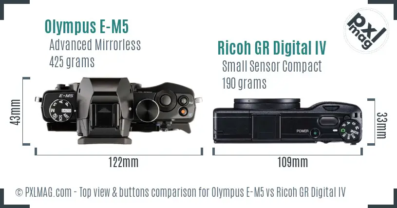 Olympus E-M5 vs Ricoh GR Digital IV top view buttons comparison Olympus E-M5 vs Ricoh GR Digital IV top view buttons comparison