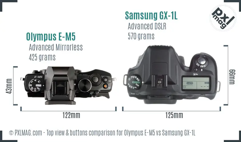 Olympus E-M5 vs Samsung GX-1L top view buttons comparison Olympus E-M5 vs Samsung GX-1L top view buttons comparison