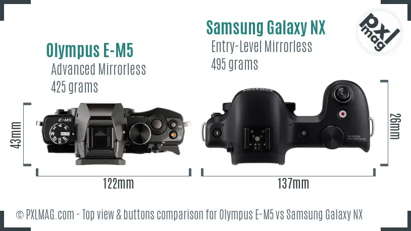 Olympus E-M5 vs Samsung Galaxy NX top view buttons comparison