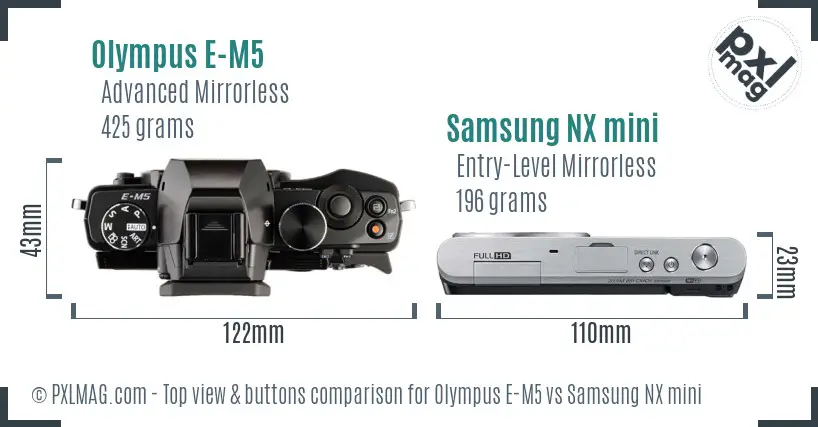 Olympus E-M5 vs Samsung NX mini top view buttons comparison Olympus E-M5 vs Samsung NX mini top view buttons comparison
