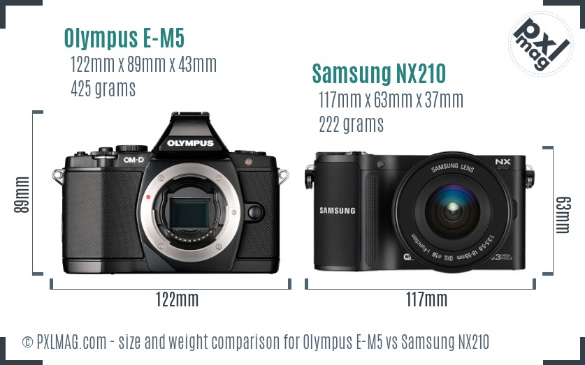Olympus E-M5 vs Samsung NX210 size comparison Olympus E-M5 vs Samsung NX210 size comparison