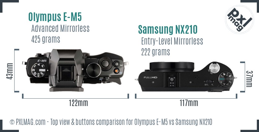 Olympus E-M5 vs Samsung NX210 top view buttons comparison