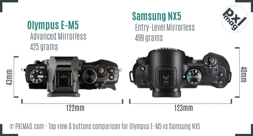 Olympus E-M5 vs Samsung NX5 top view buttons comparison Olympus E-M5 vs Samsung NX5 top view buttons comparison