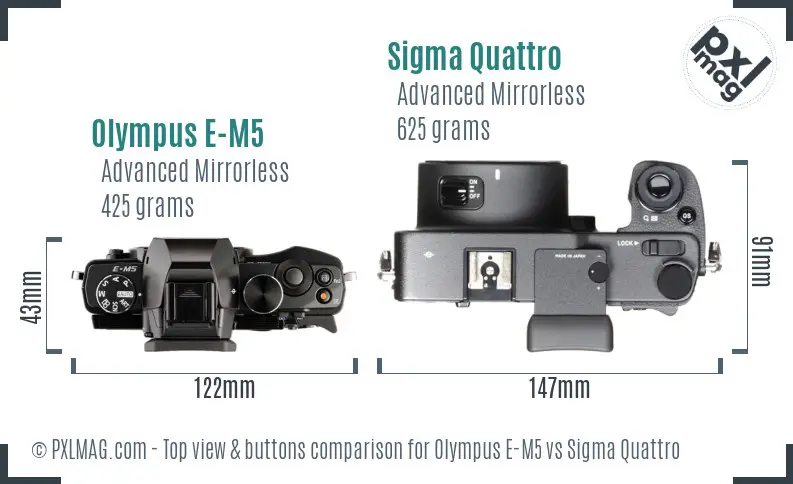 Olympus E-M5 vs Sigma Quattro top view buttons comparison