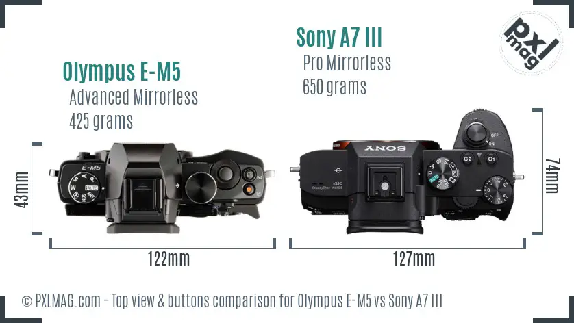 Olympus E-M5 vs Sony A7 III top view buttons comparison