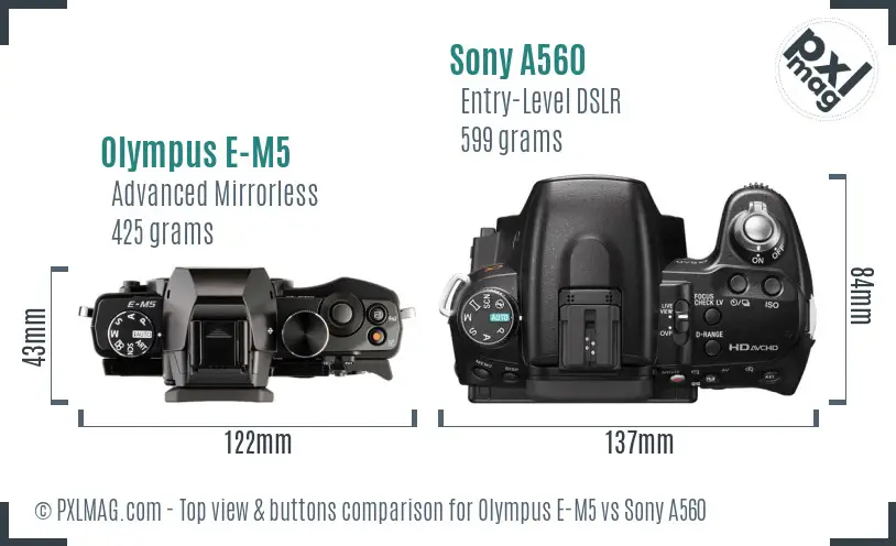 Olympus E-M5 vs Sony A560 top view buttons comparison