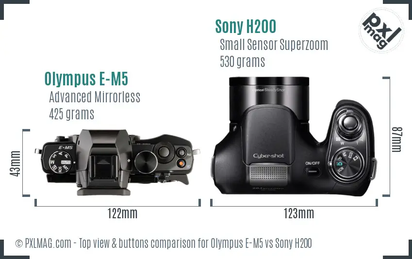 Olympus E-M5 vs Sony H200 top view buttons comparison