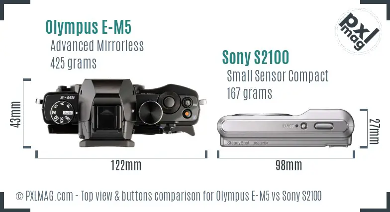 Olympus E-M5 vs Sony S2100 top view buttons comparison Olympus E-M5 vs Sony S2100 top view buttons comparison
