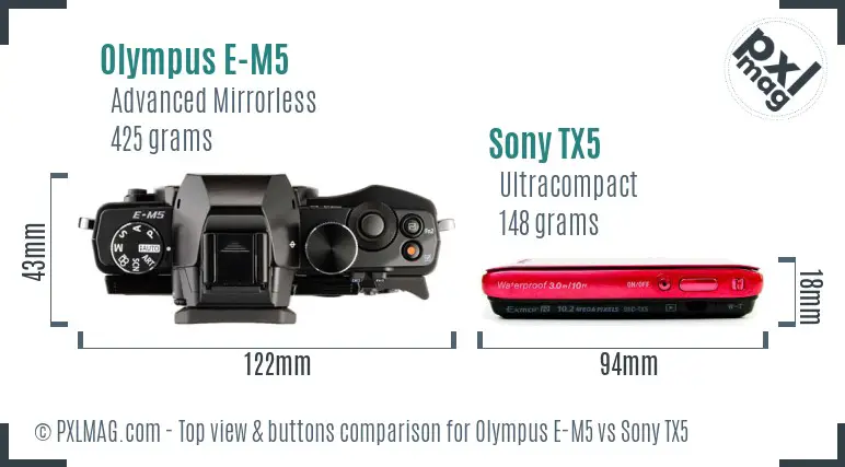 Olympus E-M5 vs Sony TX5 top view buttons comparison Olympus E-M5 vs Sony TX5 top view buttons comparison