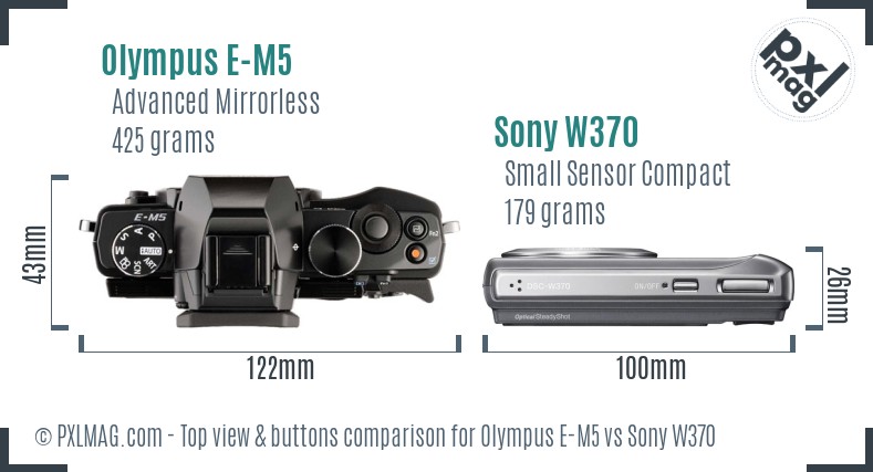 Olympus E-M5 vs Sony W370 top view buttons comparison