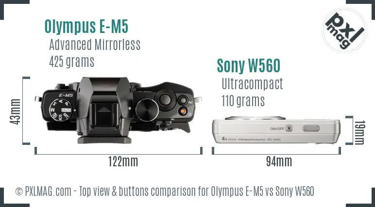 Olympus E-M5 vs Sony W560 top view buttons comparison