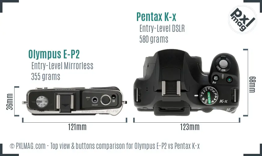 Olympus E-P2 vs Pentax K-x top view buttons comparison