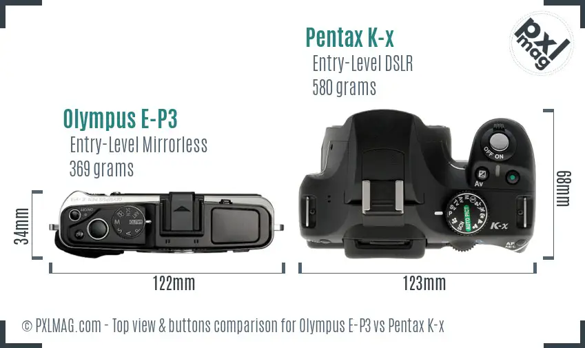 Olympus E-P3 vs Pentax K-x top view buttons comparison