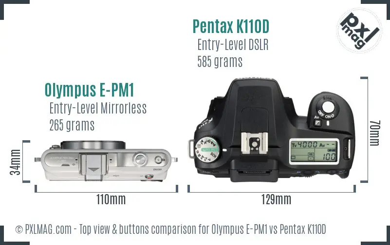 Olympus E-PM1 vs Pentax K110D top view buttons comparison