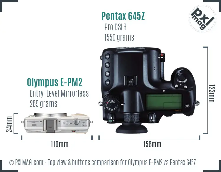 Olympus E-PM2 vs Pentax 645Z top view buttons comparison