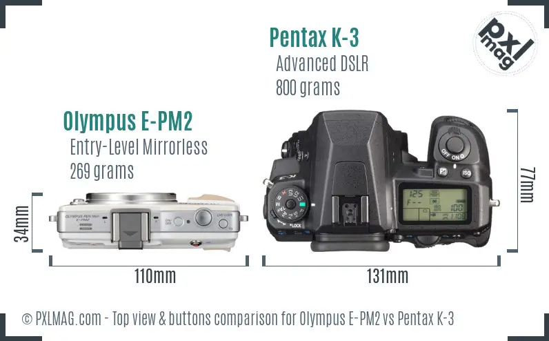 Olympus E-PM2 vs Pentax K-3 top view buttons comparison