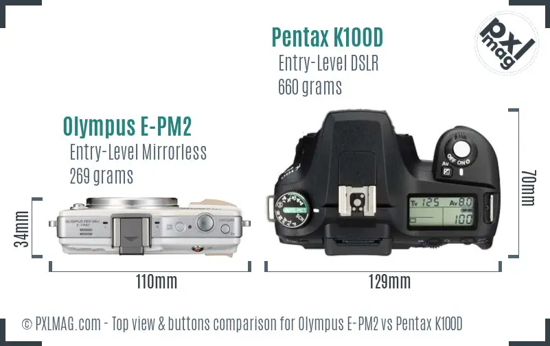 Olympus E-PM2 vs Pentax K100D top view buttons comparison