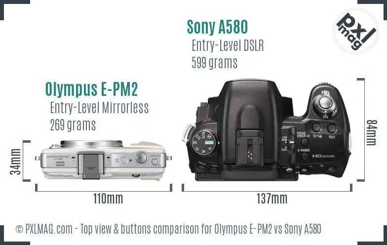 Olympus E-PM2 vs Sony A580 top view buttons comparison