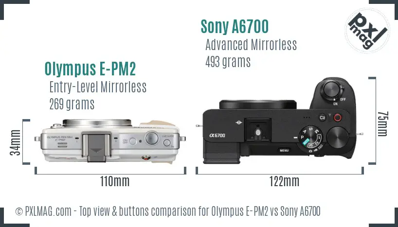 Olympus E-PM2 vs Sony A6700 top view buttons comparison Olympus E-PM2 vs Sony A6700 top view buttons comparison