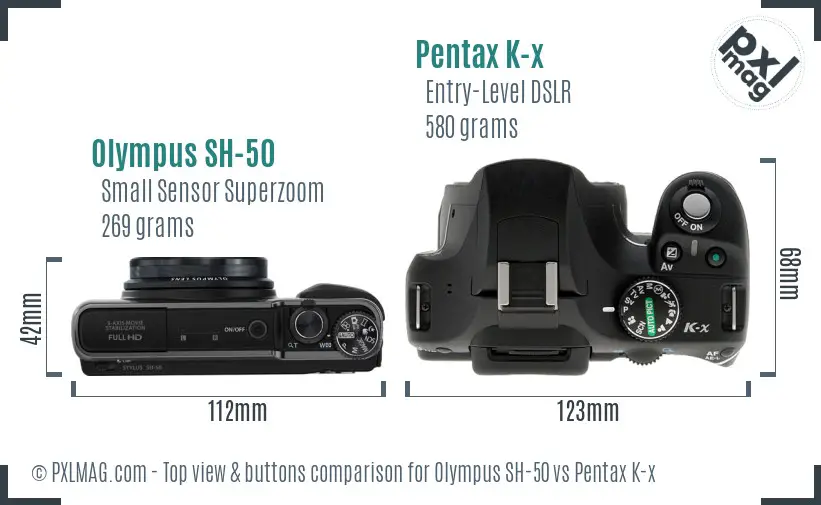 Olympus SH-50 vs Pentax K-x top view buttons comparison