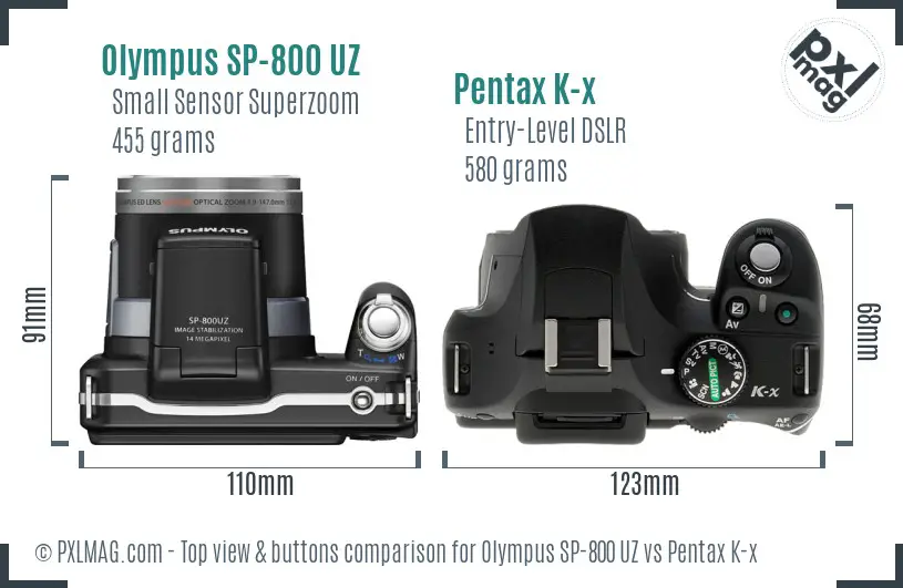 Olympus SP-800 UZ vs Pentax K-x top view buttons comparison