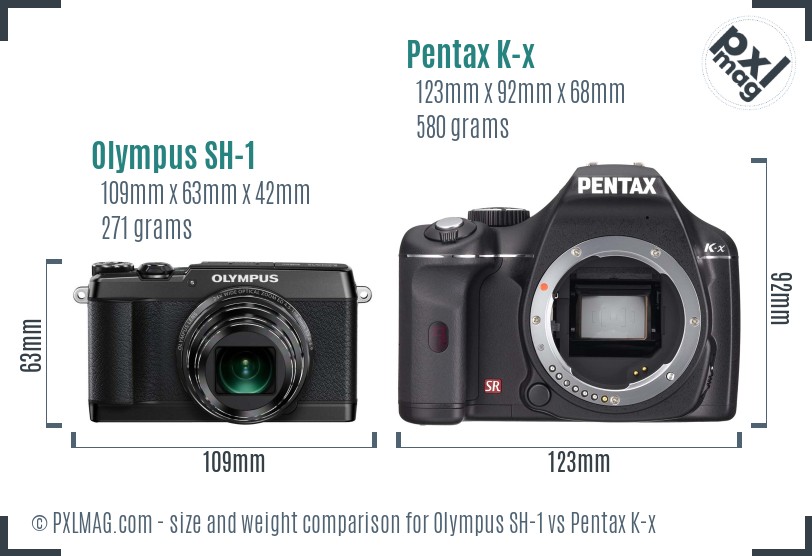 Olympus SH-1 vs Pentax K-x size comparison