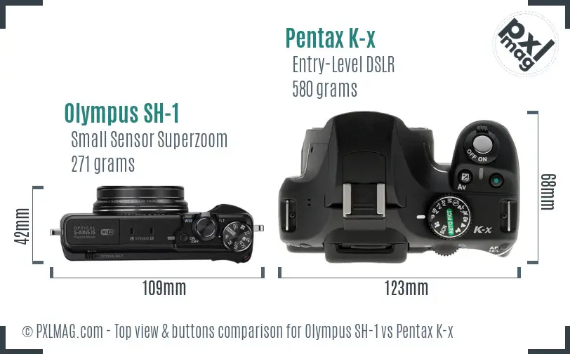 Olympus SH-1 vs Pentax K-x top view buttons comparison