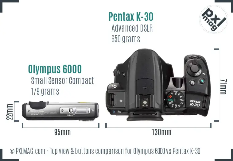Olympus 6000 vs Pentax K-30 top view buttons comparison