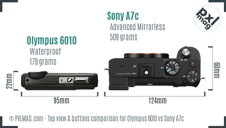 Olympus 6010 vs Sony A7c top view buttons comparison