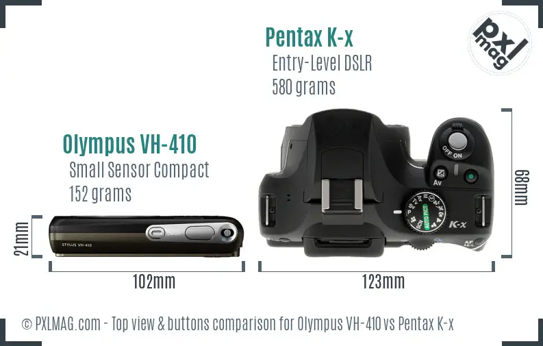 Olympus VH-410 vs Pentax K-x top view buttons comparison
