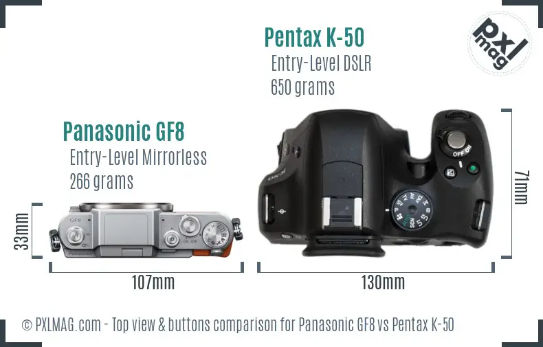 Panasonic GF8 vs Pentax K-50 top view buttons comparison