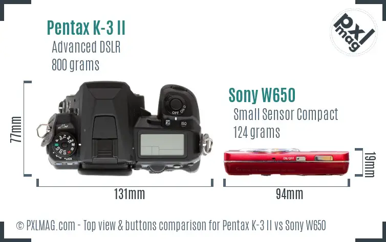 Pentax K-3 II vs Sony W650 top view buttons comparison