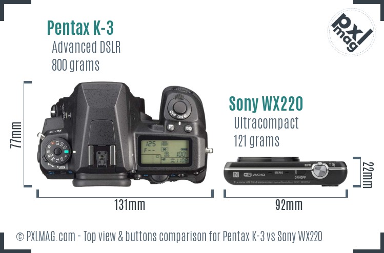 Pentax K-3 vs Sony WX220 top view buttons comparison